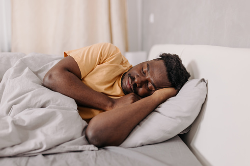 Man sleeping peacefully in bed